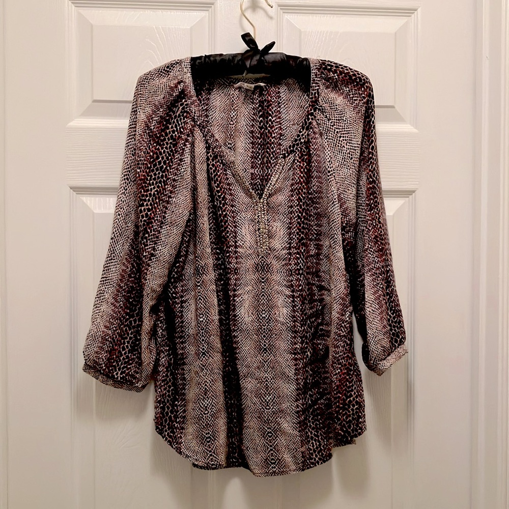 Very pretty light weight blouse with gorgeous silver bedazzled low neckline.